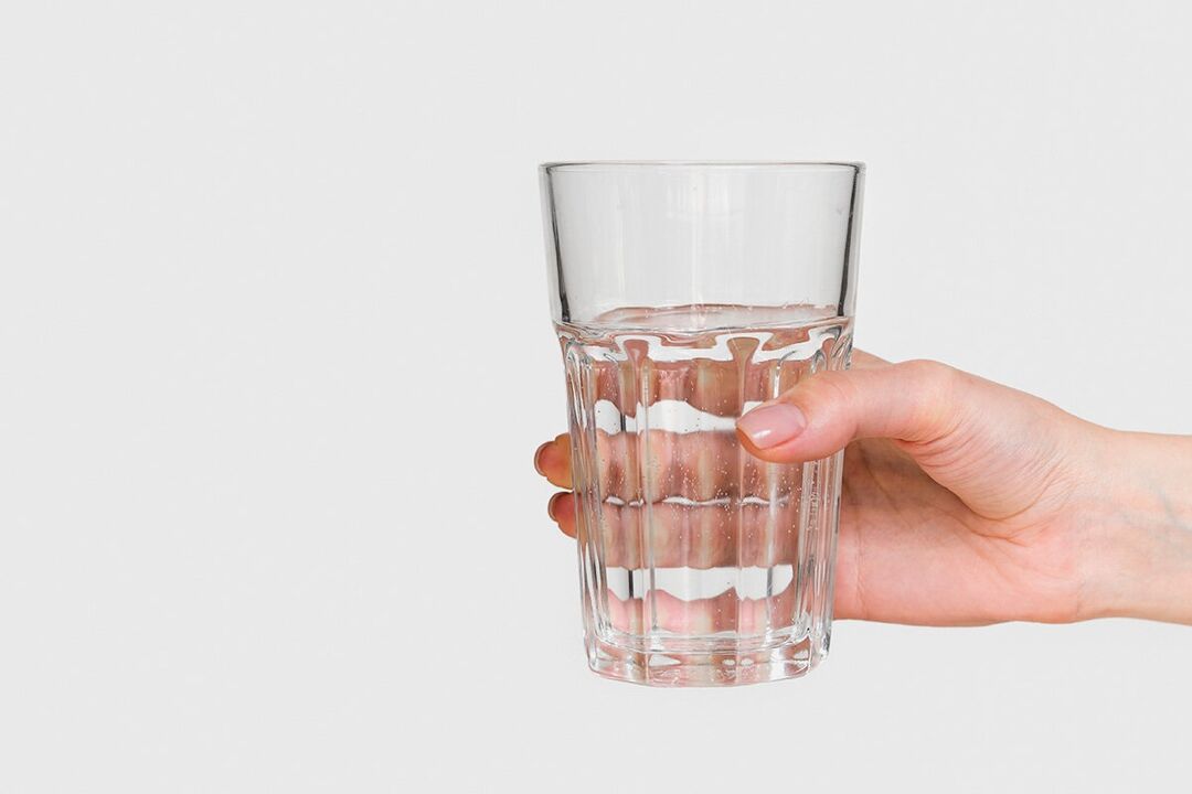Glass of water with diluted powder zxcvbnmqwert